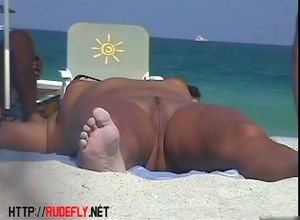 Spanish doll sunbathing nude in the..